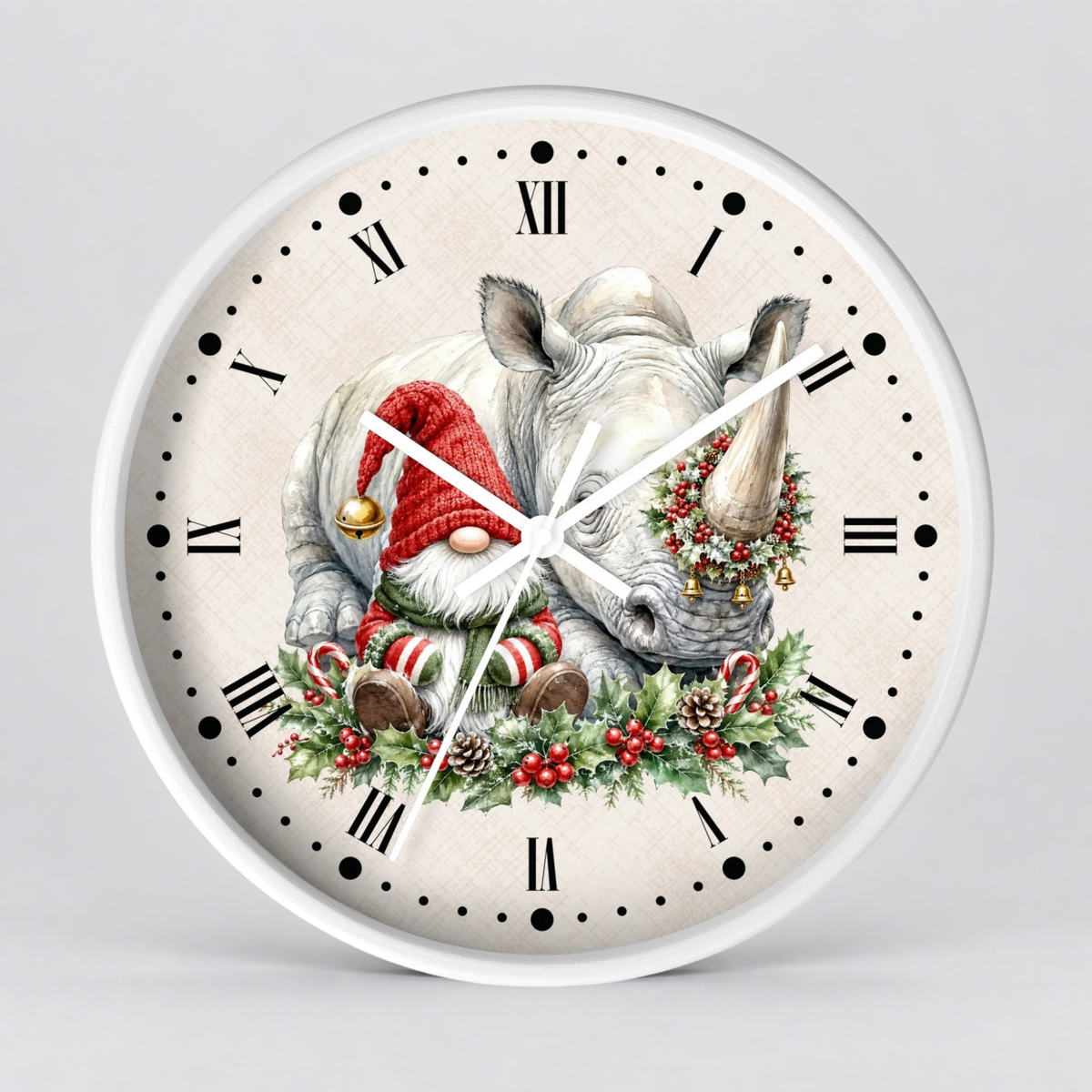 Round wall clock with a white frame and a cream-colored face featuring a Christmas gnome sitting on a white rhinoceros surrounded by holiday greenery, red berries, and candy canes, with black Roman numerals and white clock hands.