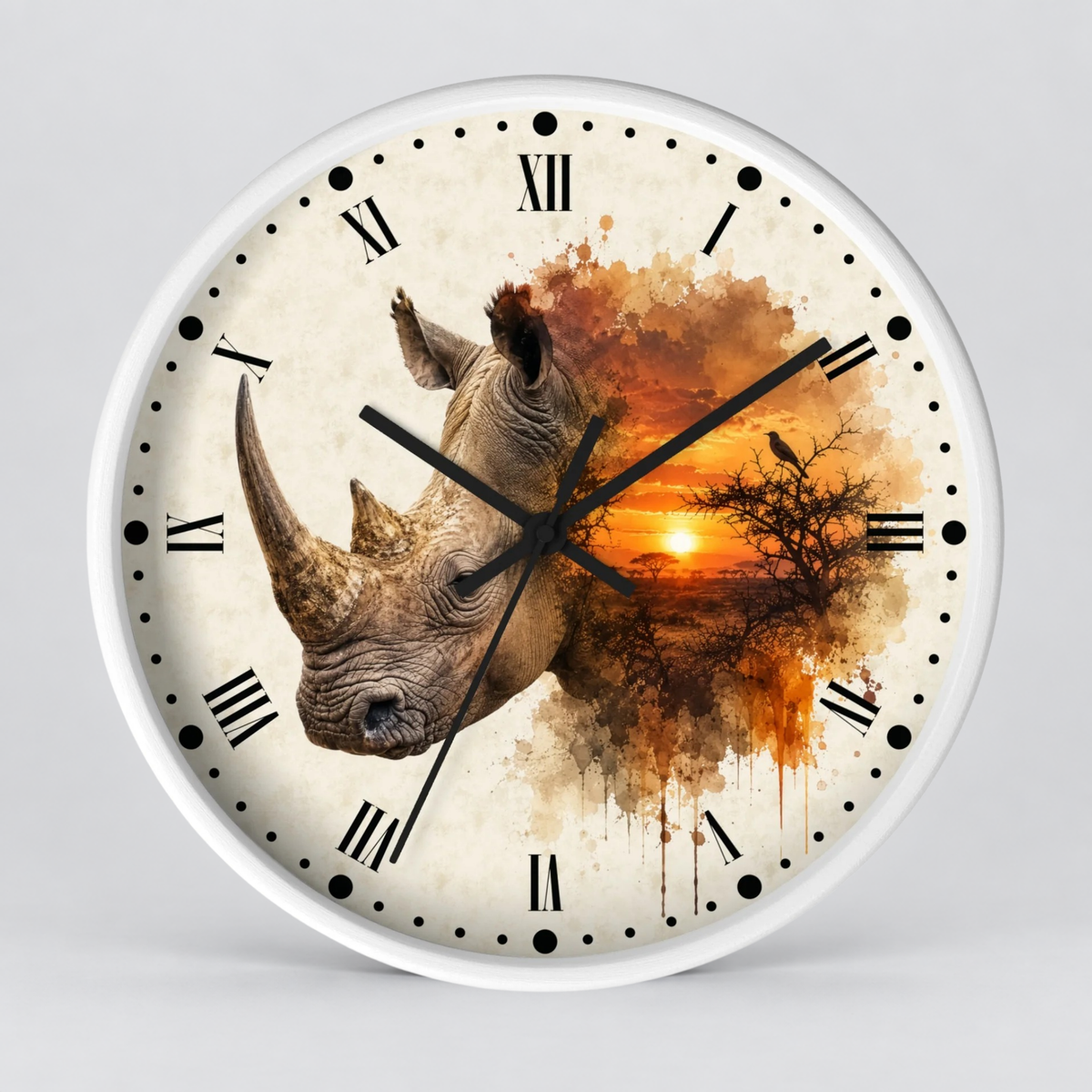 A round wall clock with a white frame and a printed face featuring a rhinoceros head merging into an orange sunset landscape with tree silhouettes and black Roman numerals.