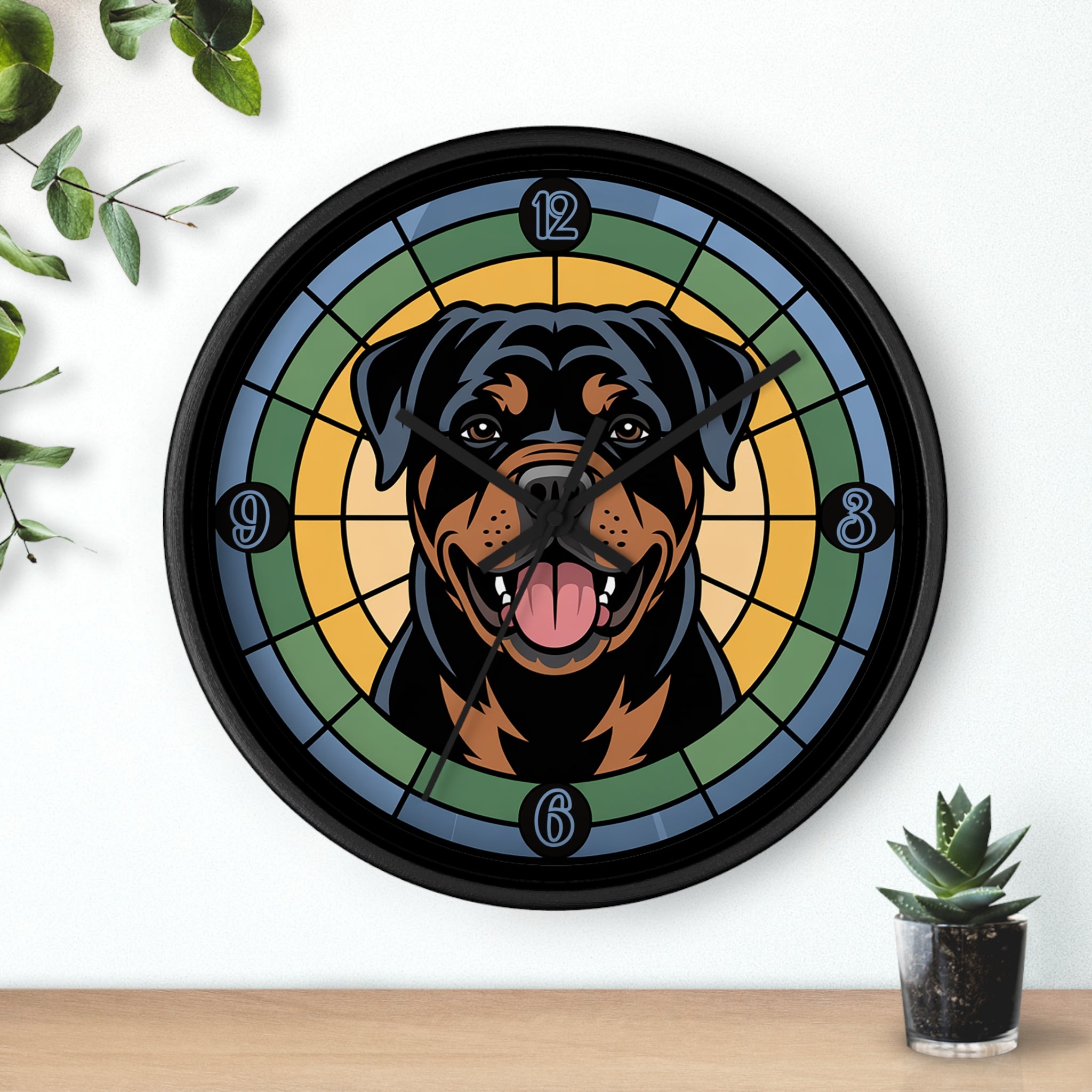 Wall clock with a Rottweiler design on a white wall with a plant and small pot.