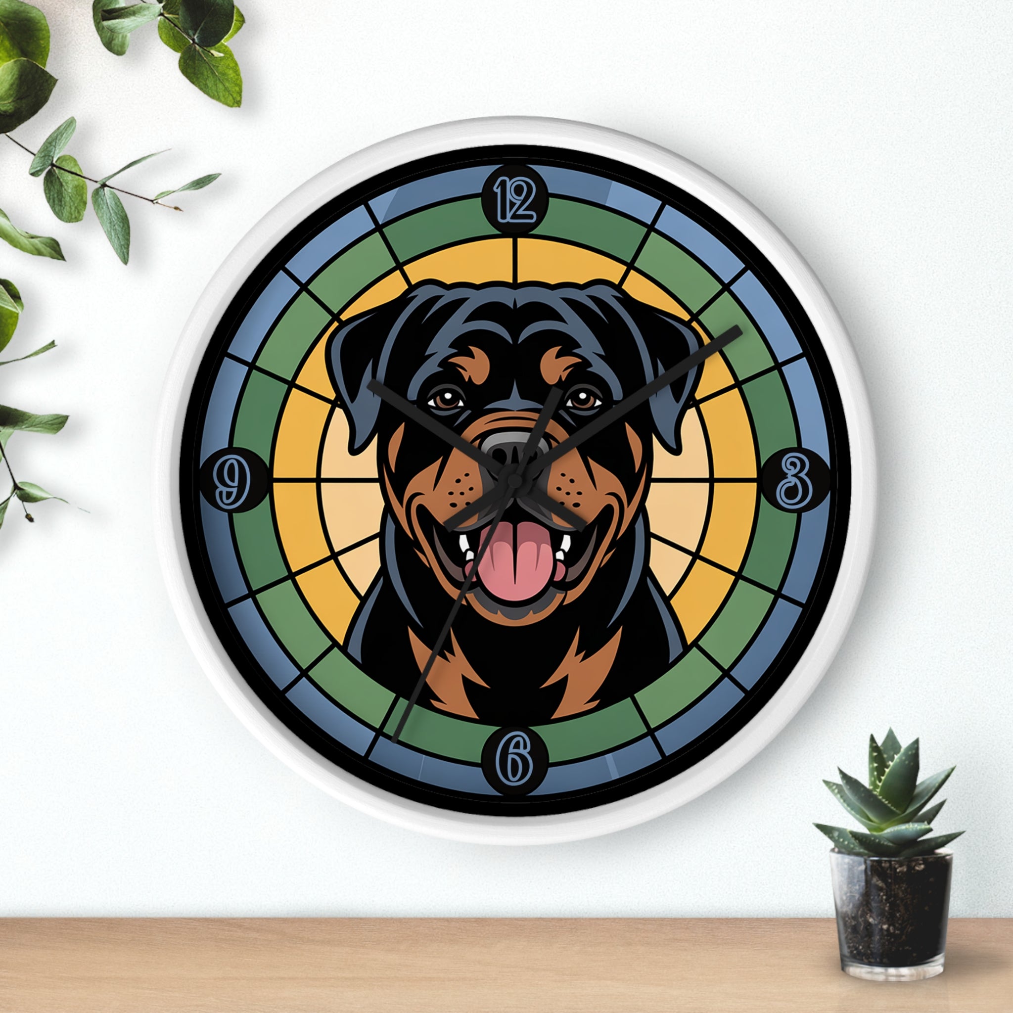 White wall clock with a Rottweiler design on a white wall with plants.
