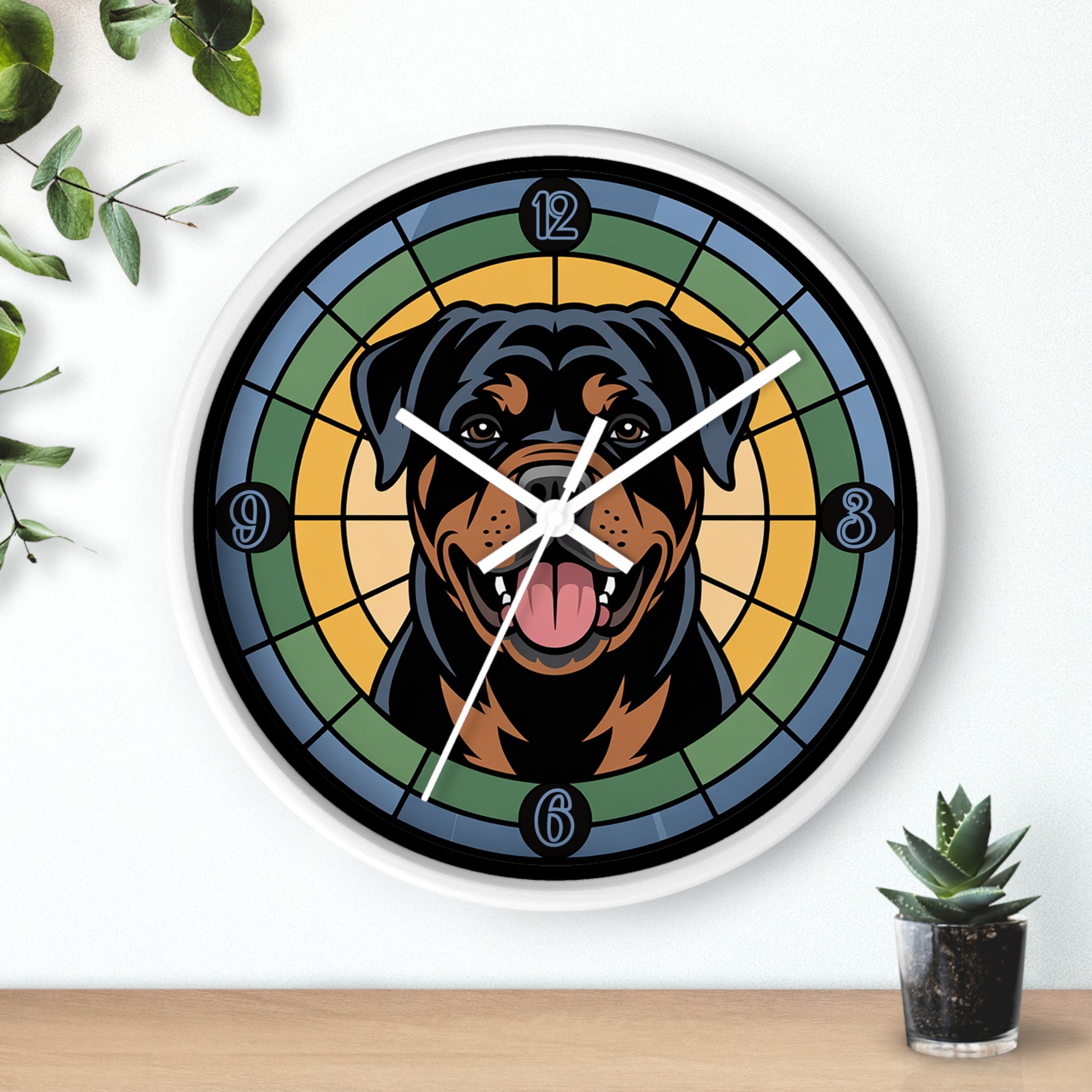 White wall clock with a Rottweiler design on a white wall with plants.
