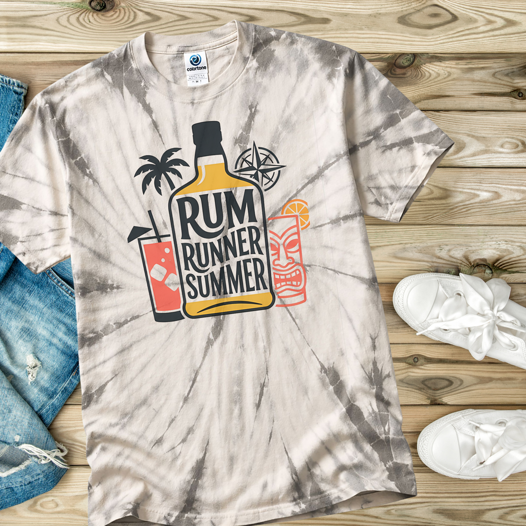 Tie-dye t-shirt with Rum Runner Summer graphic on a wooden surface with jeans and sneakers.