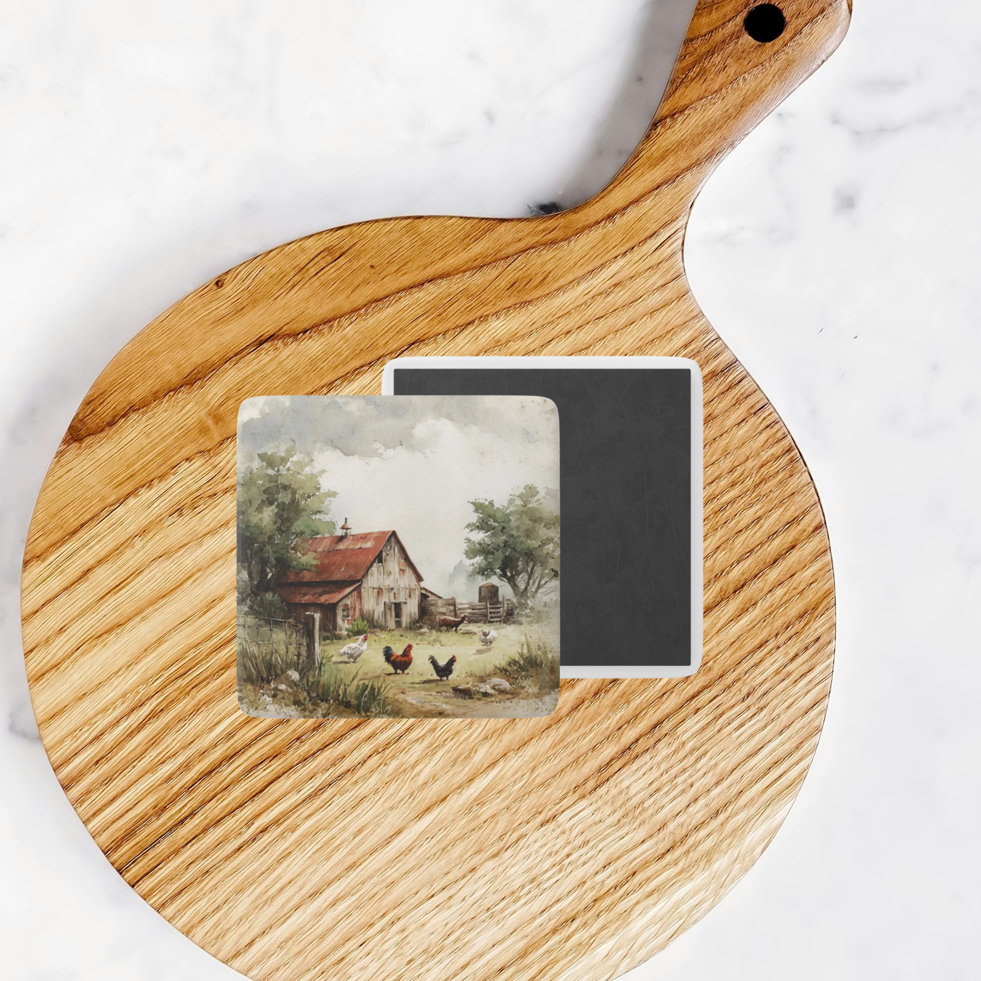 Two magnets with nature-themed designs on a wooden cutting board.