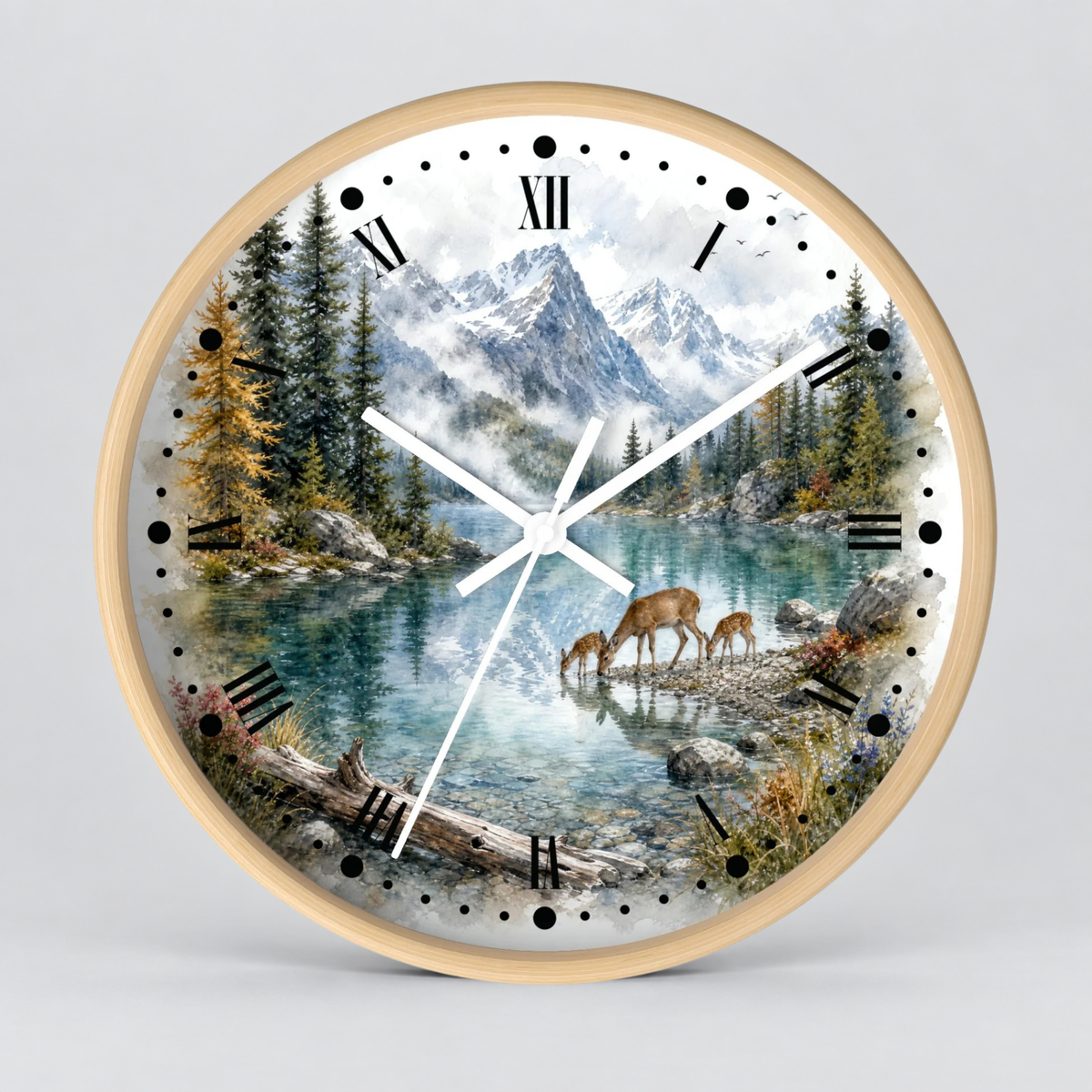 Round wall clock with a light wood frame and a scenic nature print on the face, featuring a mountain lake landscape with evergreen trees, deer, and Roman numeral hour markers.