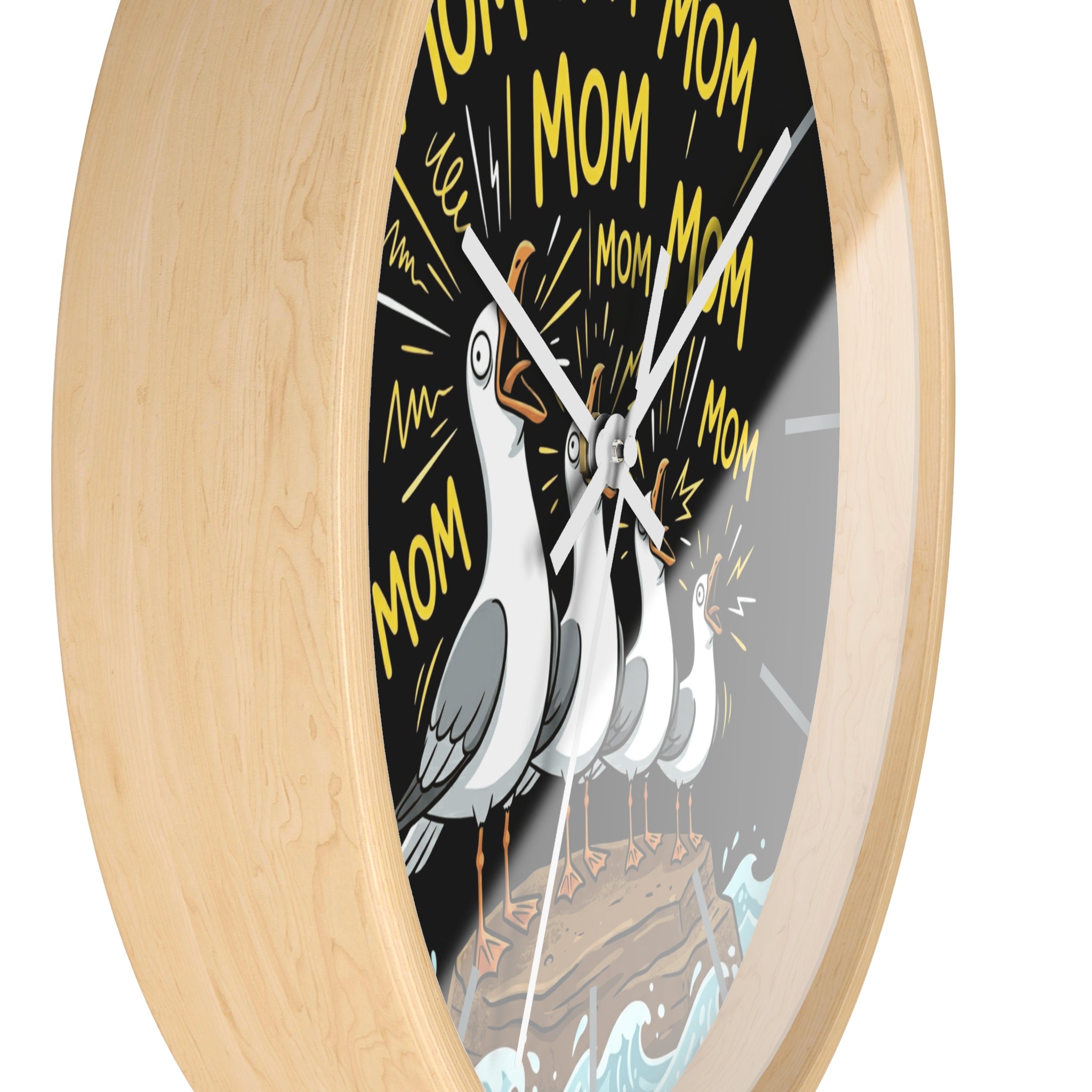 Side view of a round wood wall clock with white hands and a design of a seagull bird and 'MoM' text on a black background