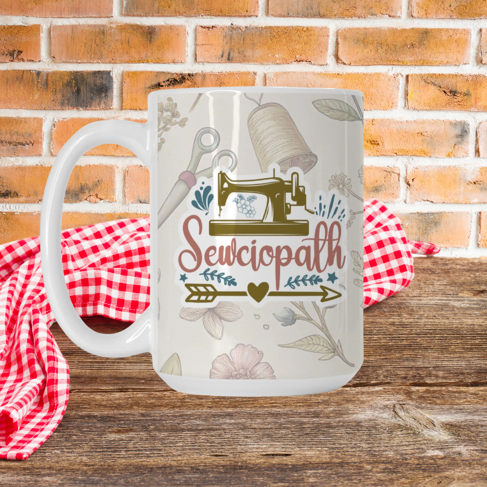 Mug with 'Sewciopath' design on a wooden surface with a brick wall background