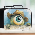  insulated lunch bag with cartoon eye design on a wooden surface