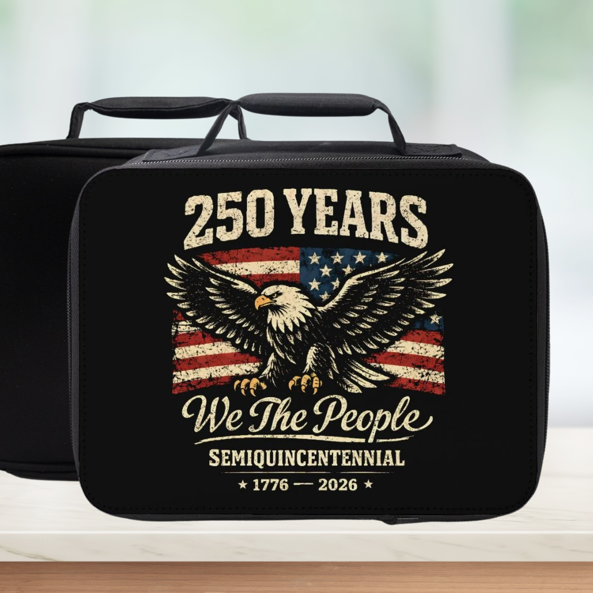 Black lunch bag with American flag and eagle design celebrating 250 years of 'We The People'.