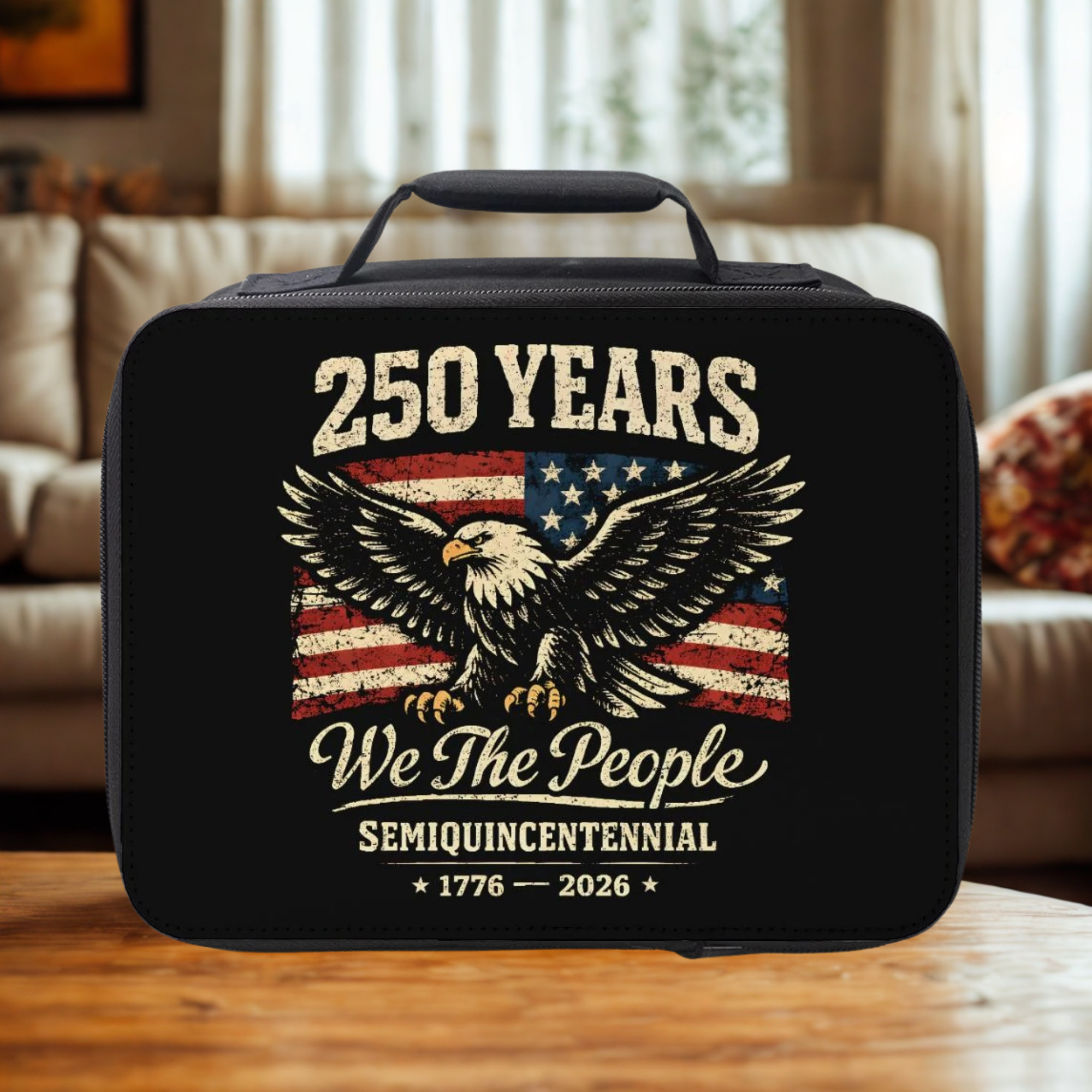 Black lunch bag with American flag and eagle design on a wooden table in a cozy living room.