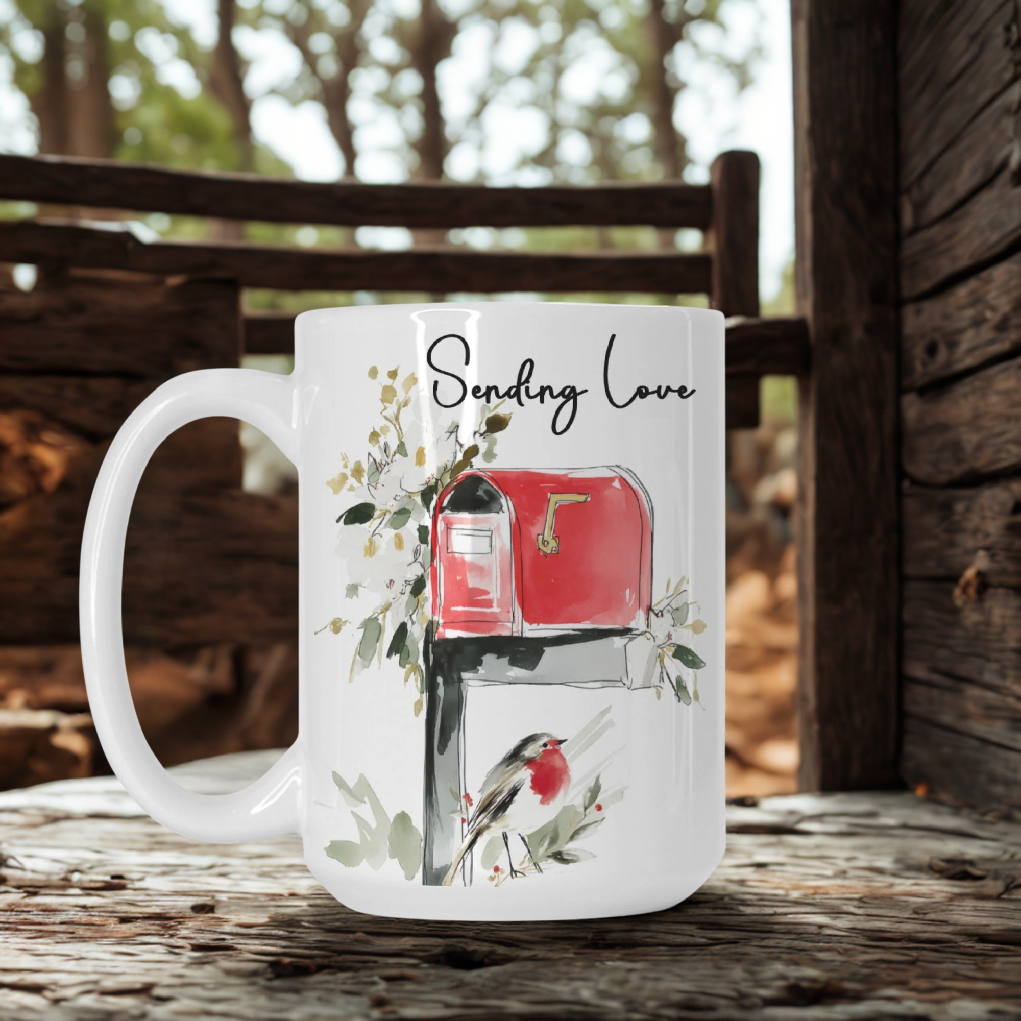 White mug with a red mailbox design and 'Sending Love' text on a wooden surface.