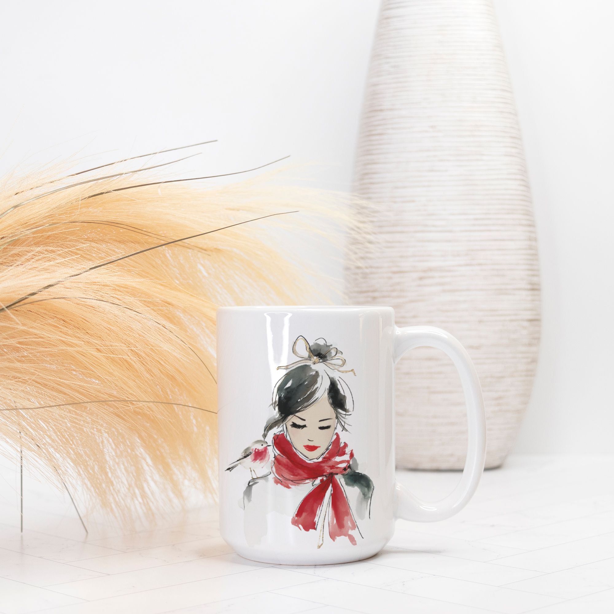 White mug with a design of a woman wearing a red scarf on a white background