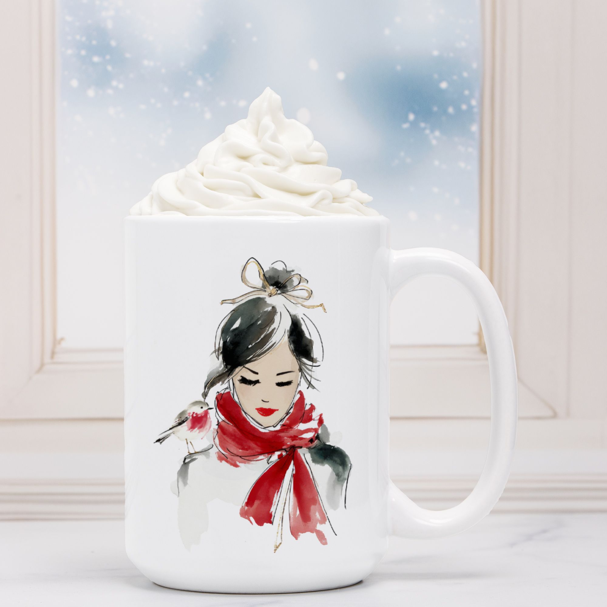 White mug with a decorative design of a woman wearing a red scarf, filled with hot chocolate and whipped cream.