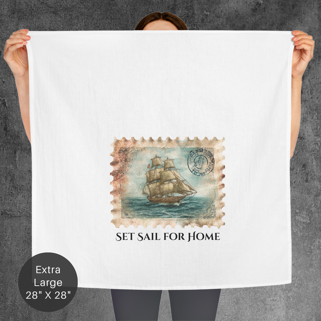 Person holding a large towel with a ship design and 'Set Sail for Home' text on a gray background