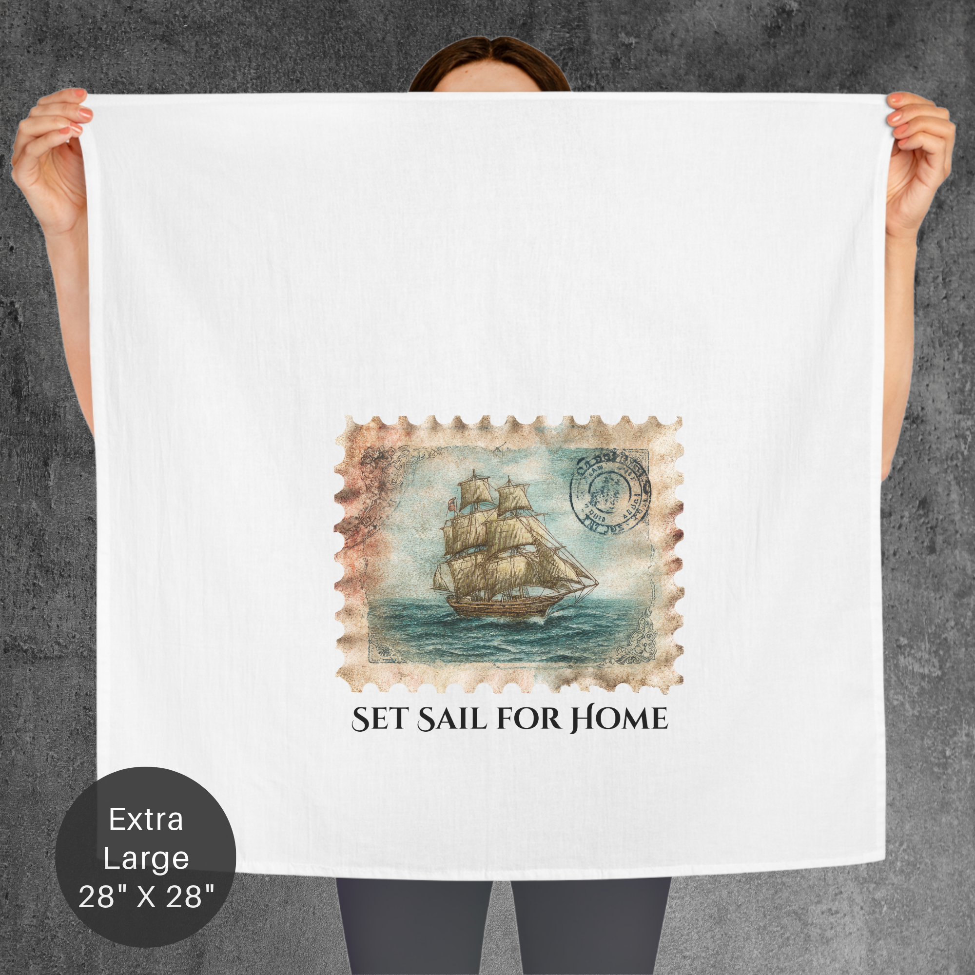 Person holding a large towel with a ship design and 'Set Sail for Home' text on a gray background