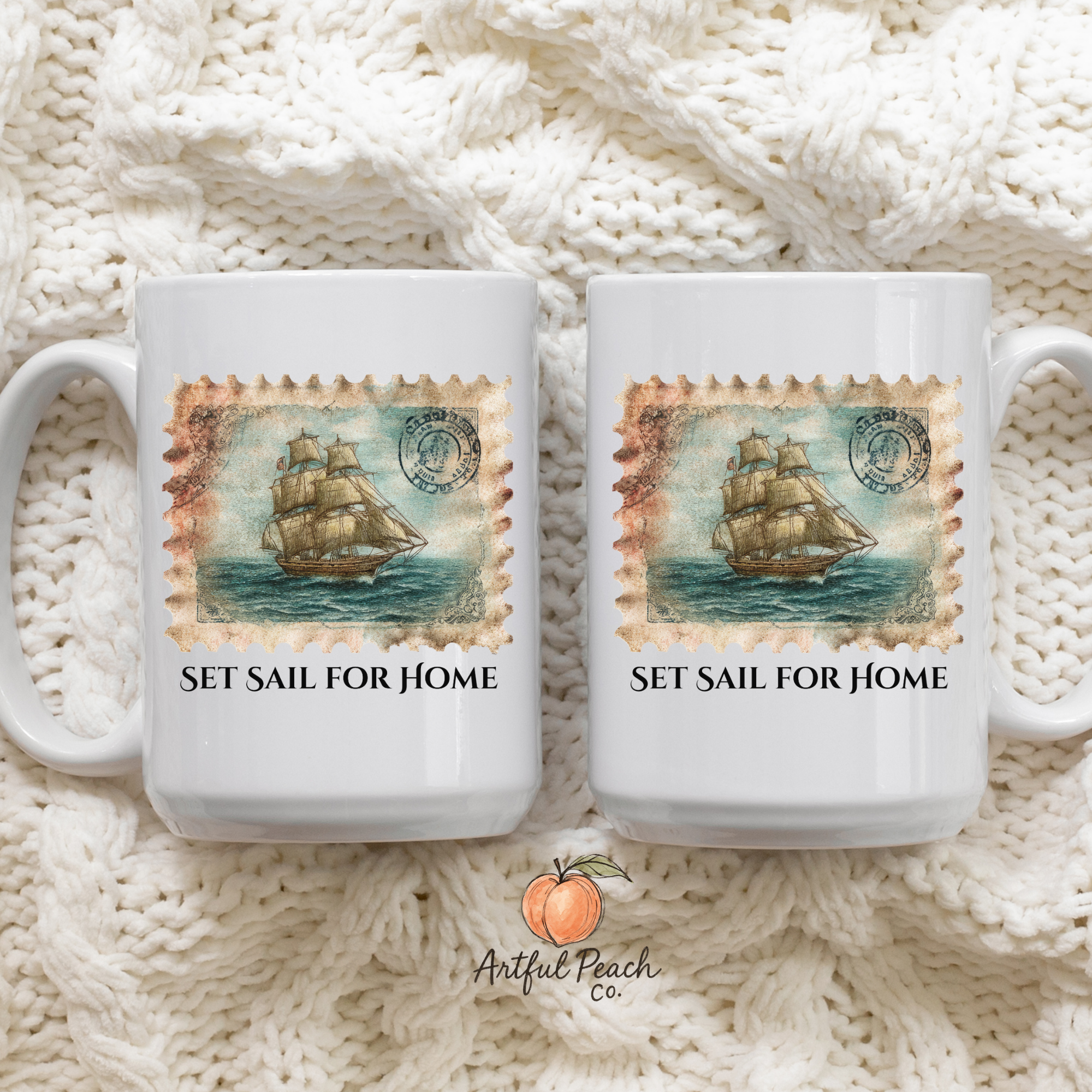 Two white mugs with ship design and 'Set Sail for Home' text on a knitted fabric background, featuring the Artful Peach Co. logo.