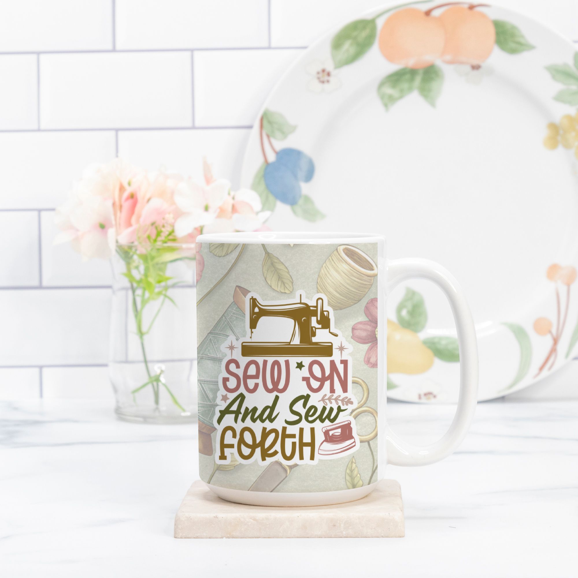 Mug with sewing-themed design and text 'Sew on and Sew Forth' in a kitchen setting.
