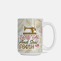 Mug with sewing-themed design and text 'Sew On And Sew Forth' on a light background