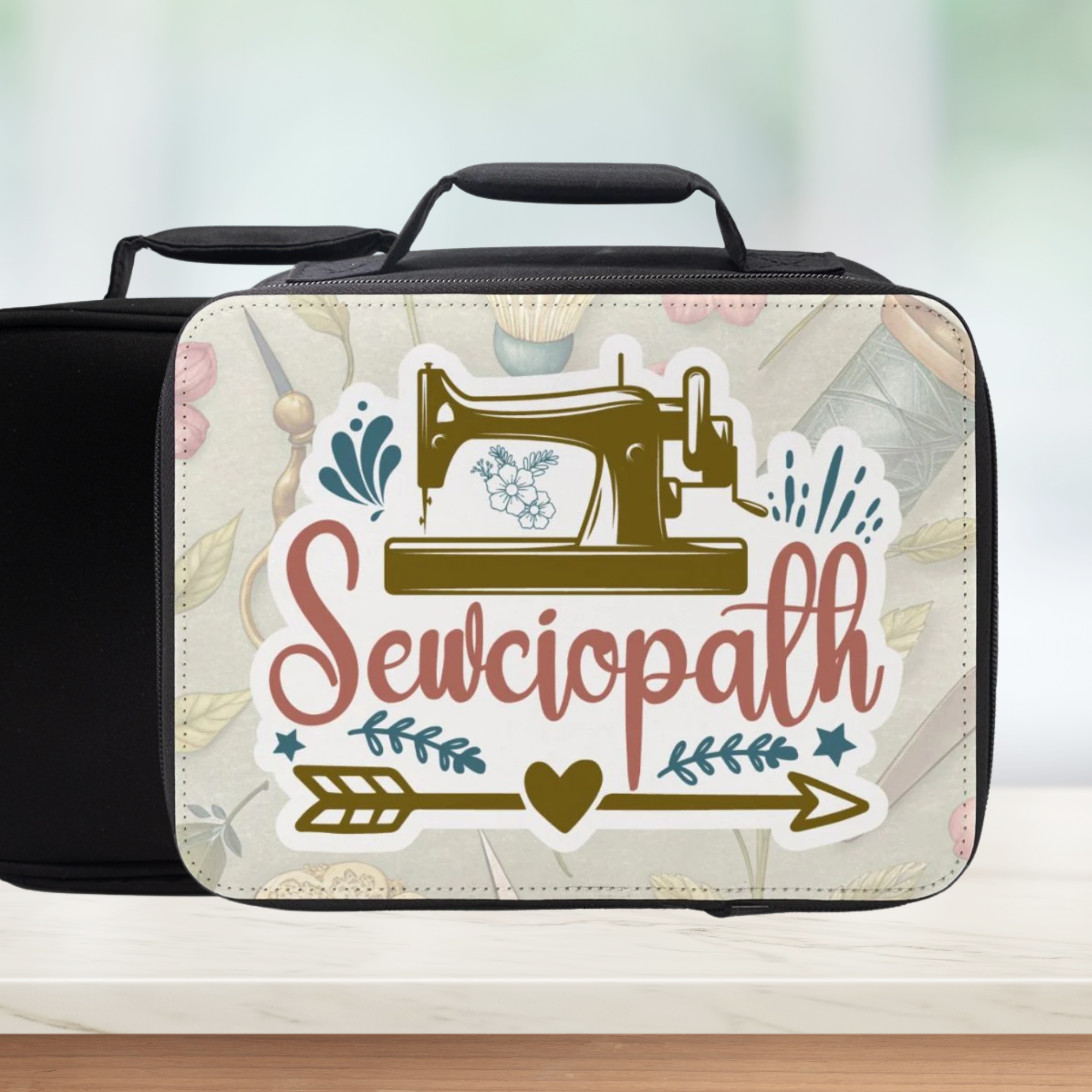 Black sewing themed lunch bag with 'Sewciopath' text design on a light background