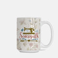 Mug with sewing-themed design and 'Sewciopath' text on a white background