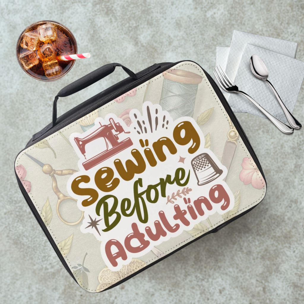 Lunch bag with 'Sewing Before Adulting' design on a table with a drink and utensils.
