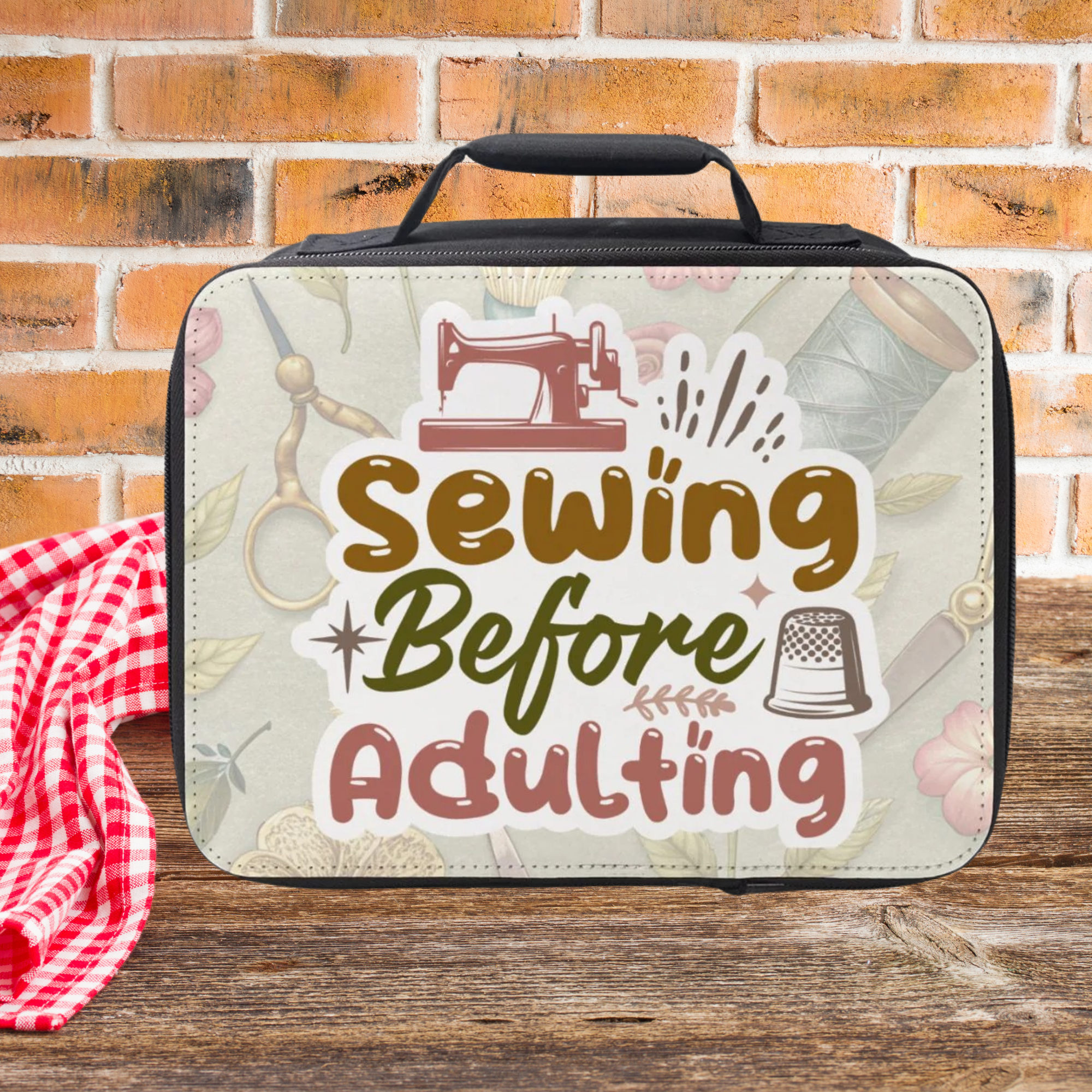 Sewing kit with 'Sewing Before Adulting' text on a wooden picnic table against a brick wall background