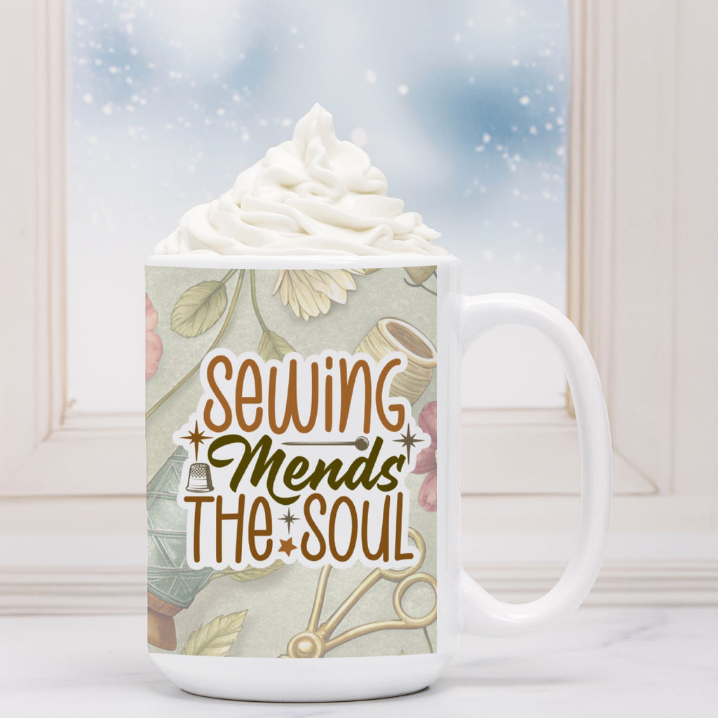 White mug with 'Sewing Mends The Soul' design and whipped cream on a light background