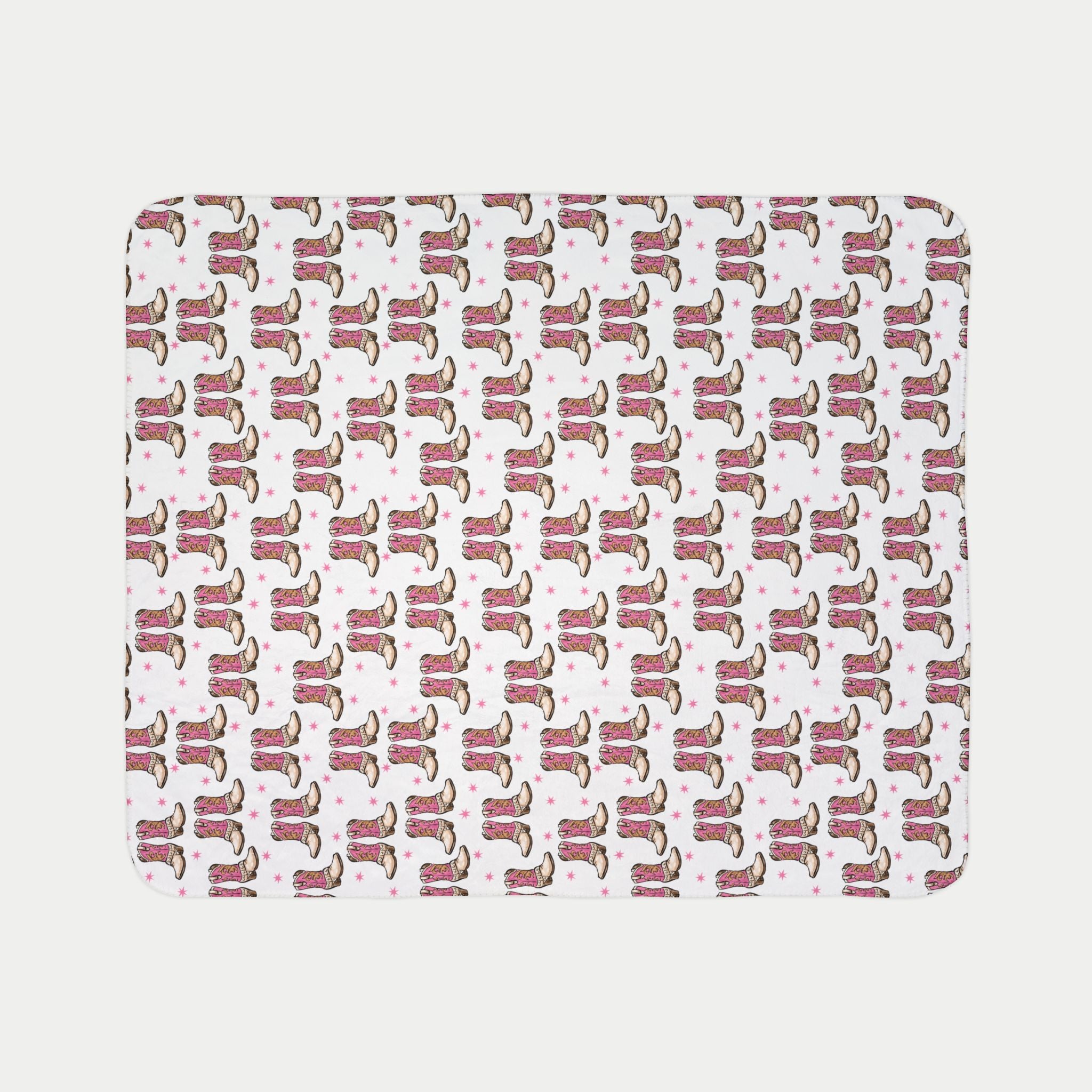 Patterned mat with pink and brown boot design on a light gray background