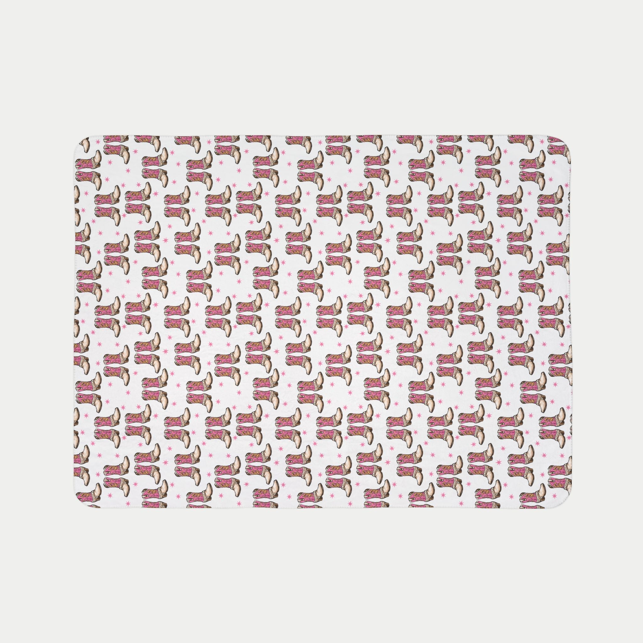 Pattern of cowboy boots on a pink background