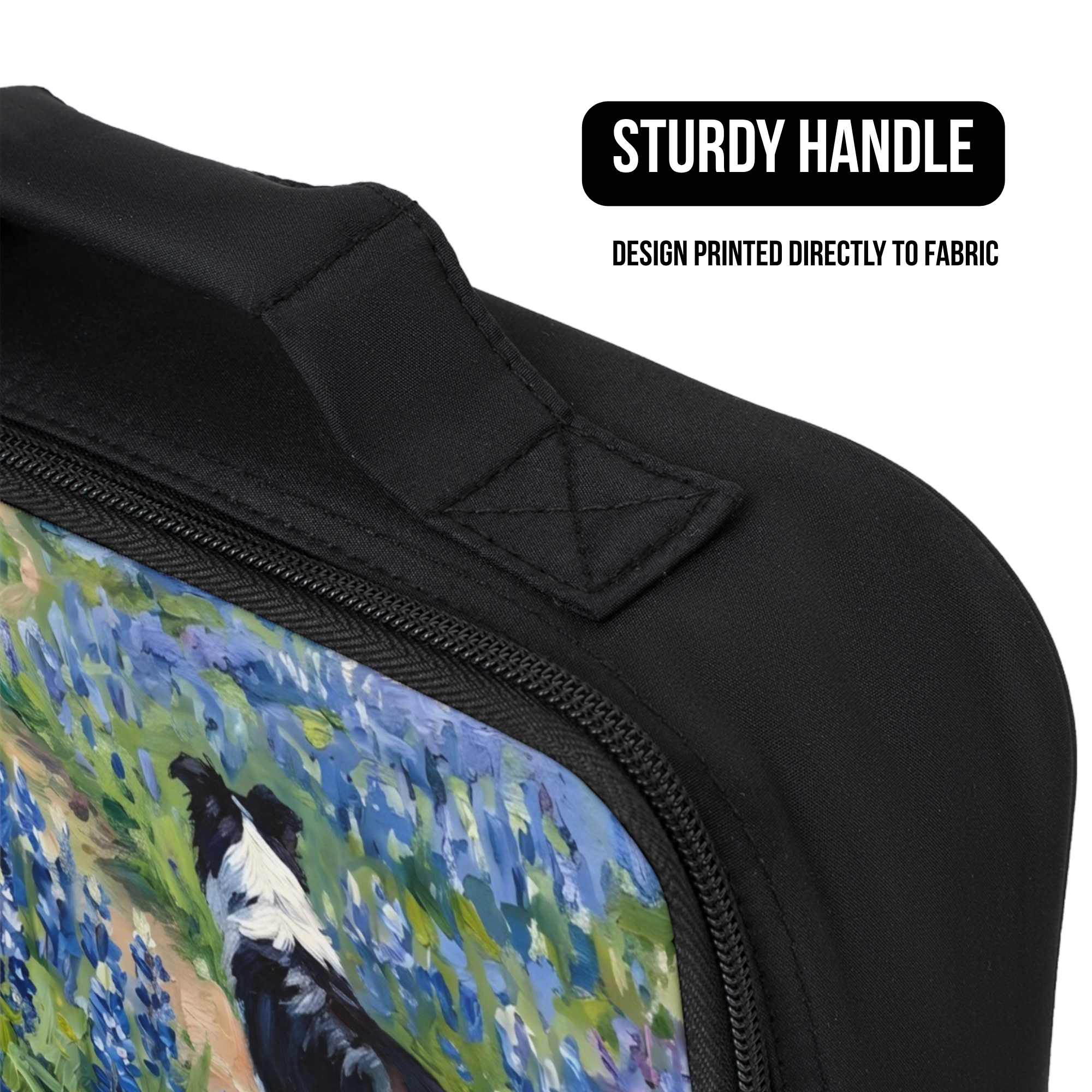 Black bag with a painted design of a bird and landscape, featuring a sturdy handle.