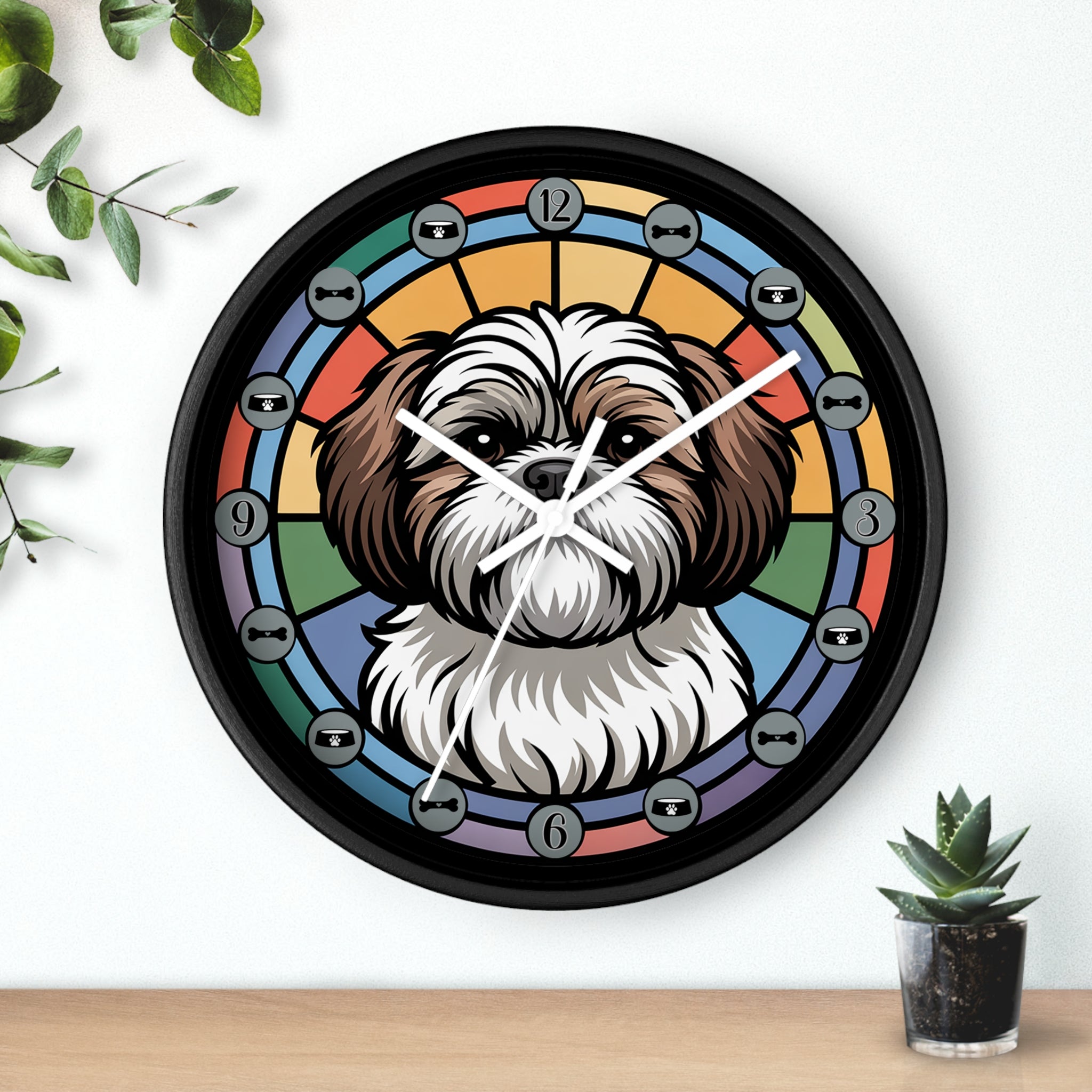 Wall clock with a Shih-Tzu dog illustration on a colorful circular design, placed on a white wall with a plant and small pot in the background.