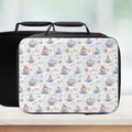 Black lunch bag with a white pattern of hand drawn ships in bottles on a light background