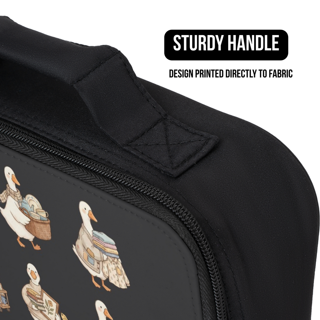 Black lunch bag with silly geese design and sturdy handle on a white background