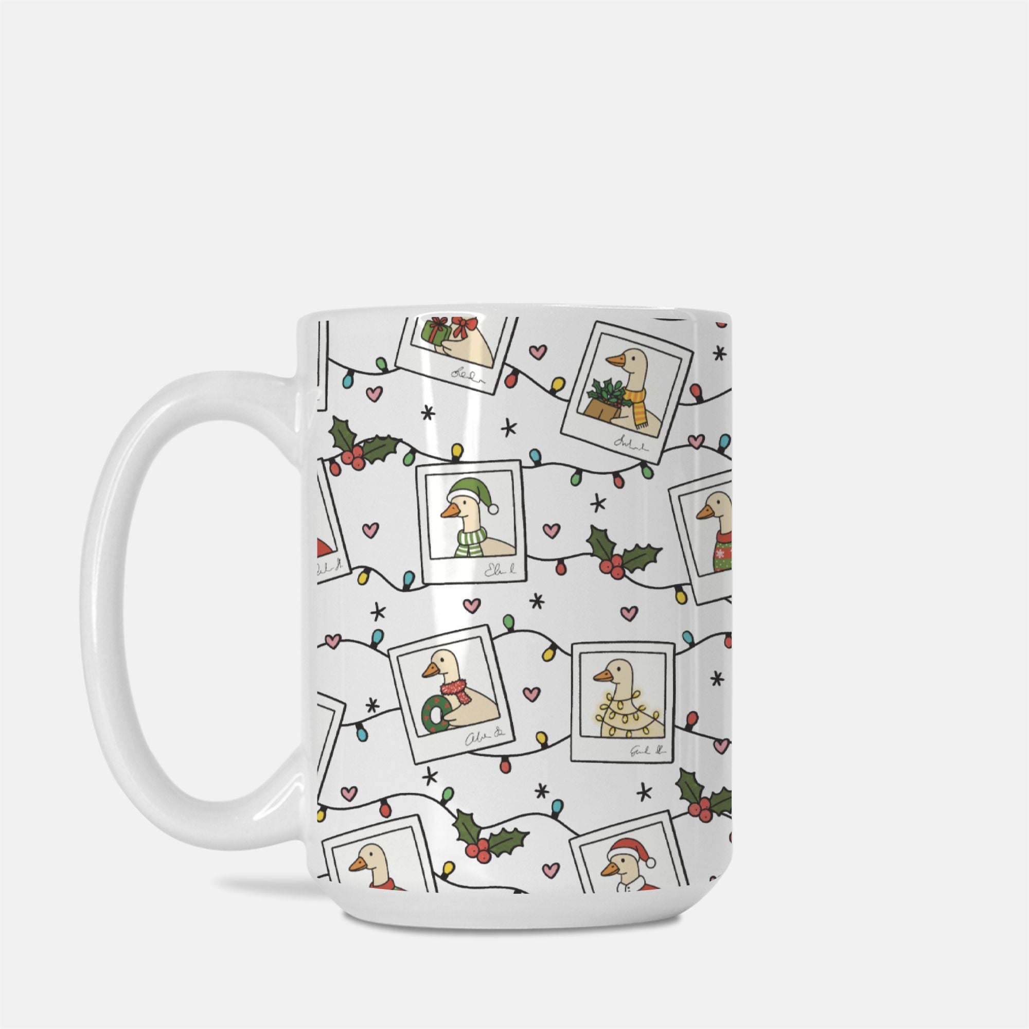 White mug with festive design featuring illustrations of a duck, holly leaves, and Christmas lights on a white background.