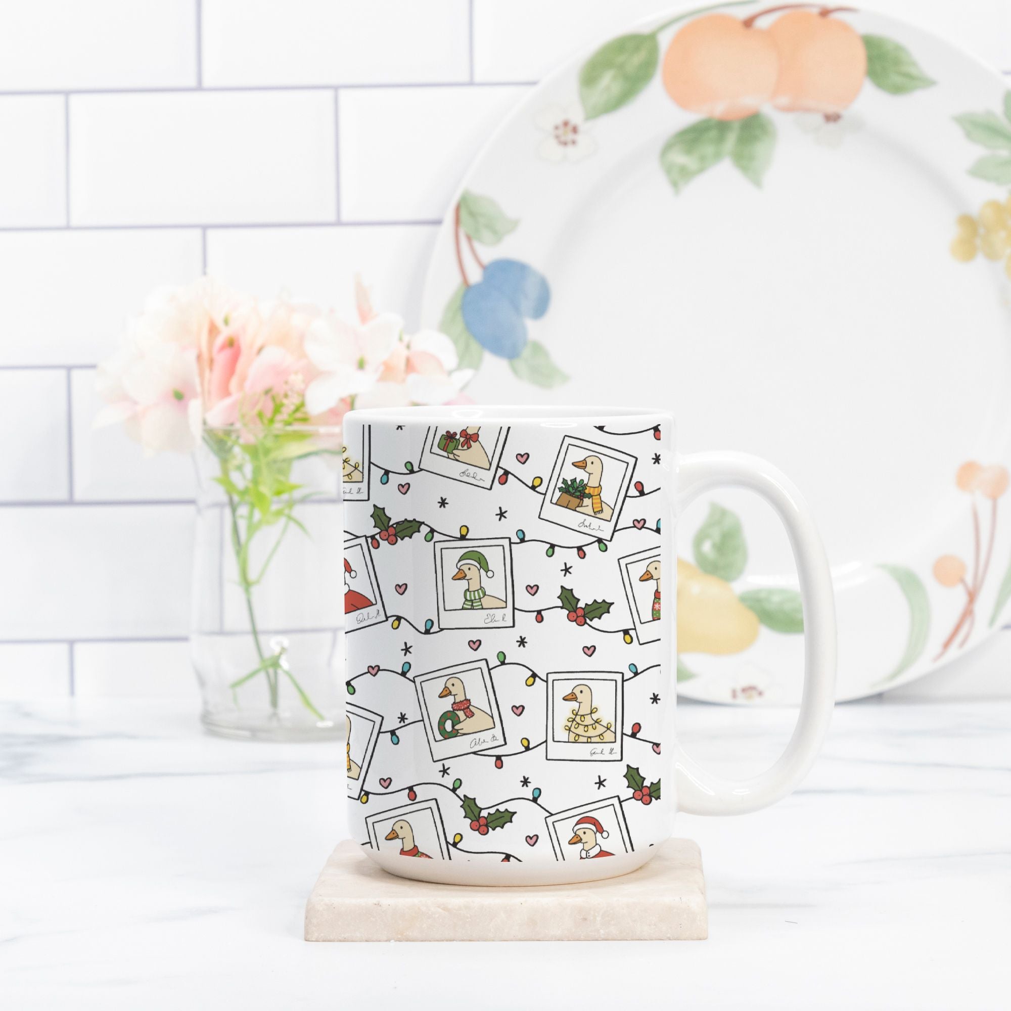 Mug with photo collage pattern on a white surface with a blurred background