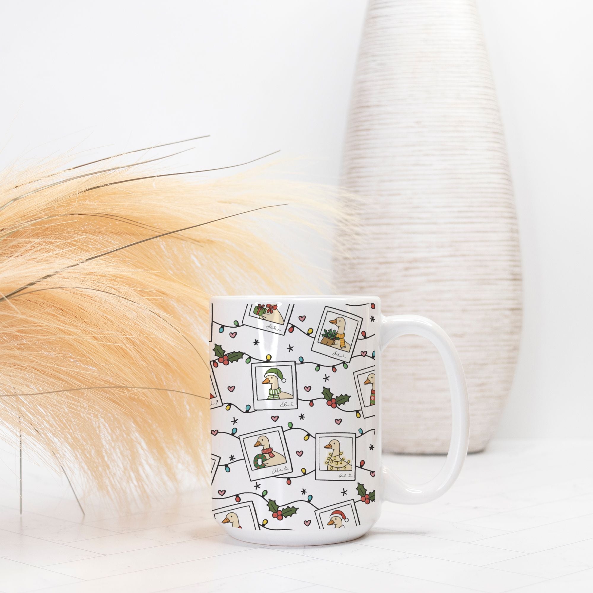 White mug with festive design featuring Santa Geese, holly leaves, and berries on a white background.