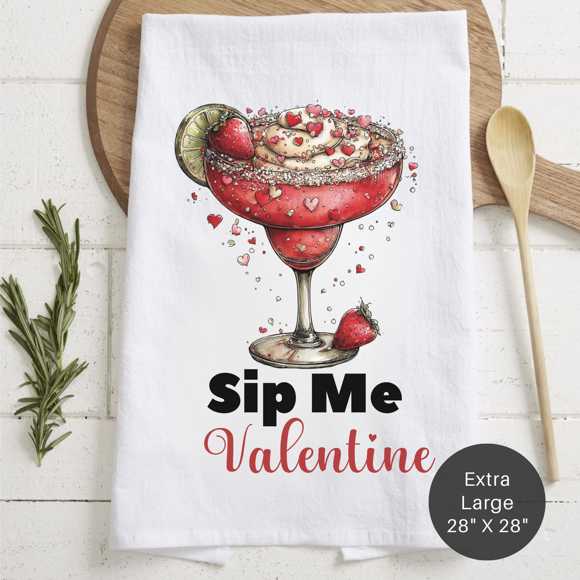 Tea towel with a Valentine's Day-themed design of a cocktail and text 'Sip Me Valentine' on a wooden board.