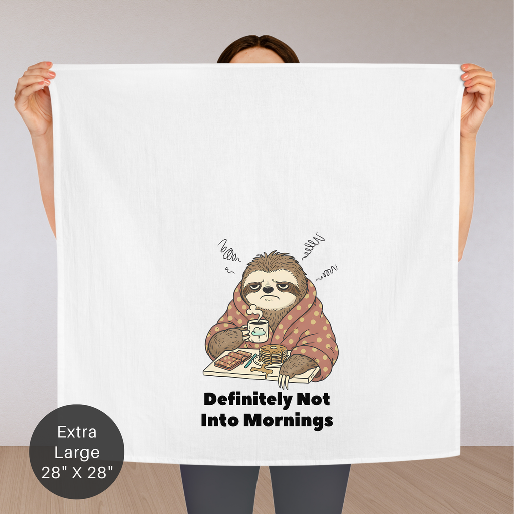 Person holding an extra large tea towel with a sloth illustration and text 'Definitely Not Into Mornings.