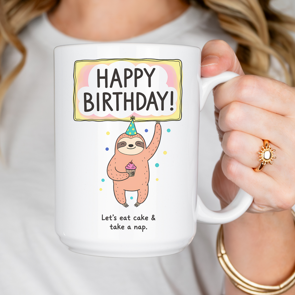 Person holding a mug with a sloth design and birthday message.