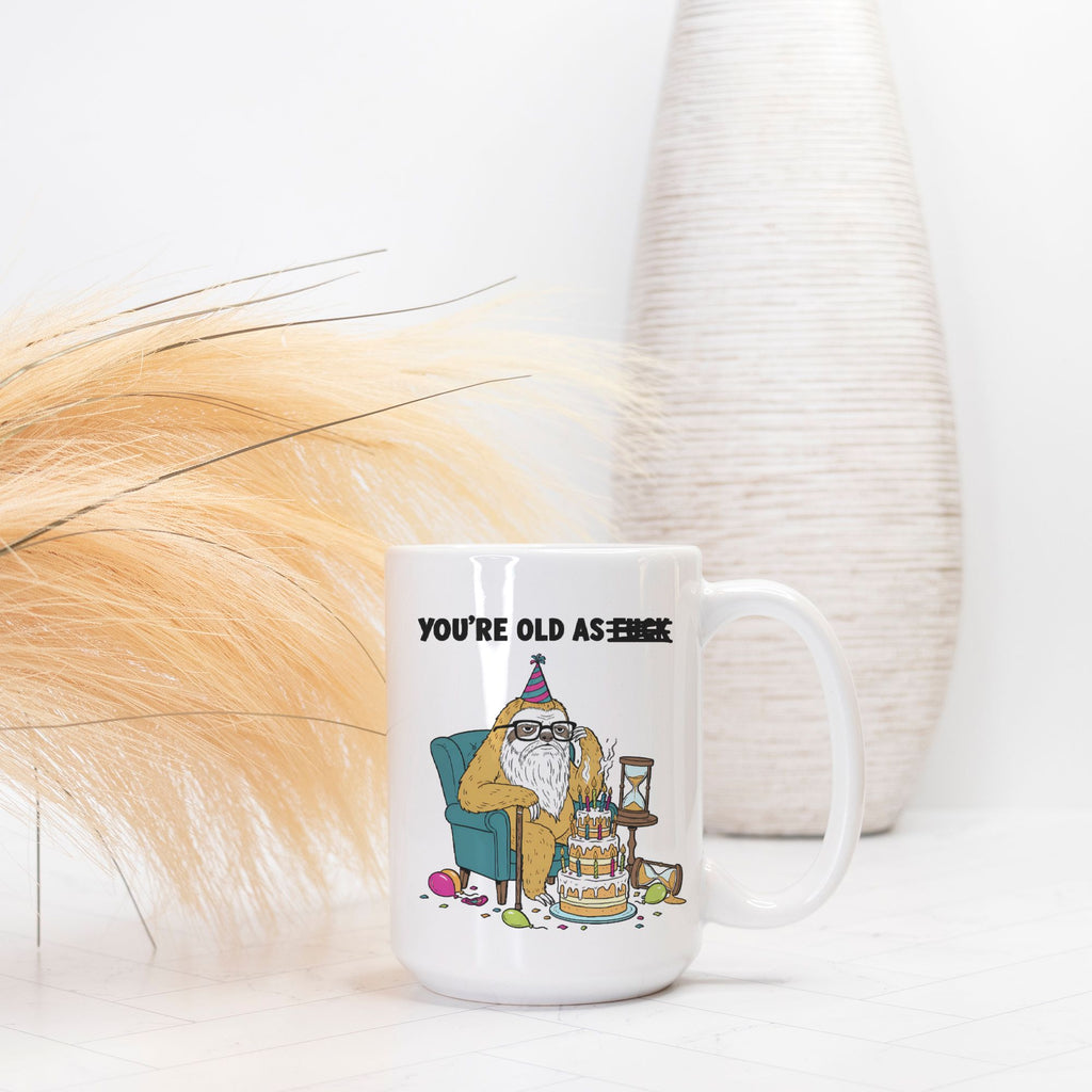 White mug with a cartoon character and text on a white background