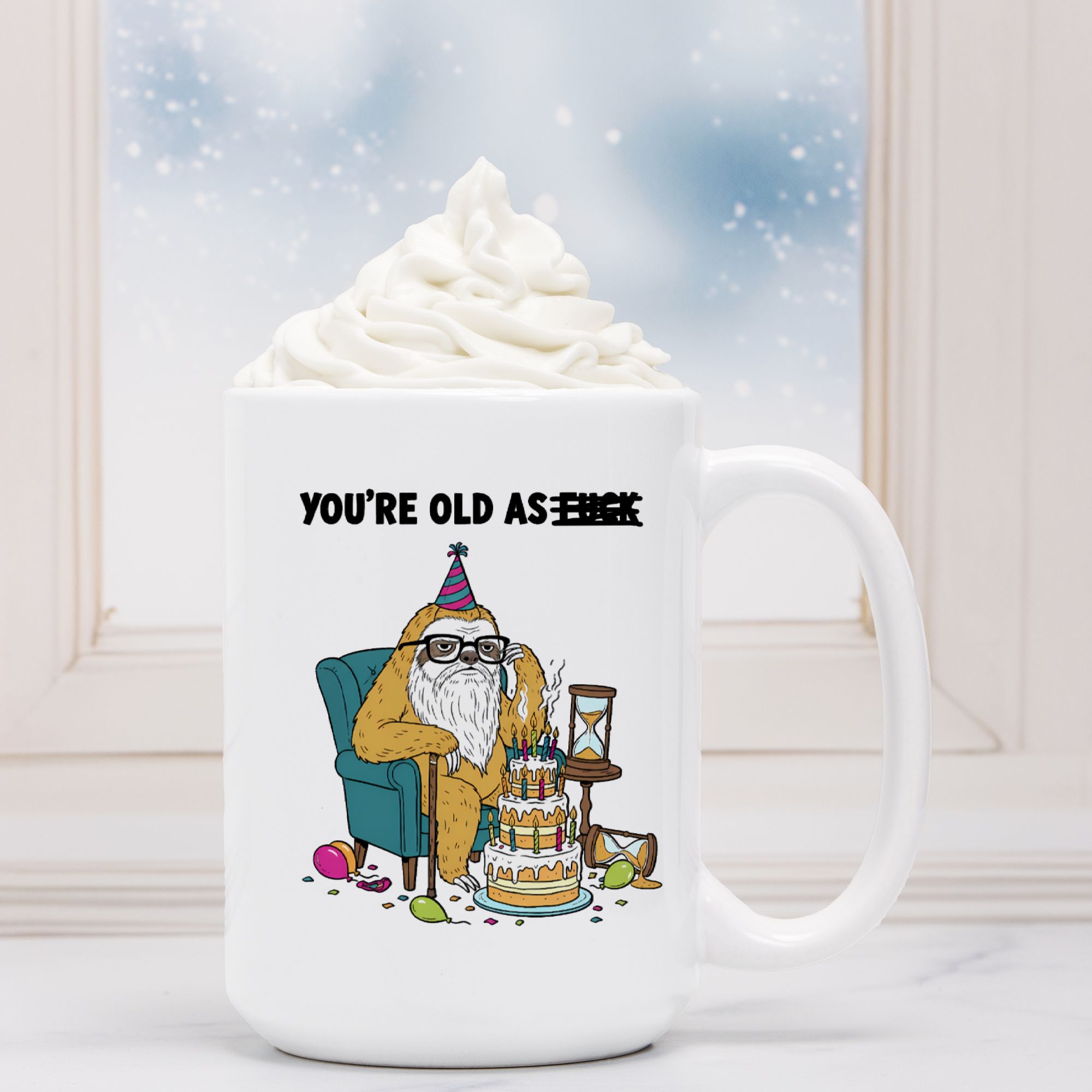 White mug with a cartoon design of a bear celebrating a birthday, text 'You're old as F***'.