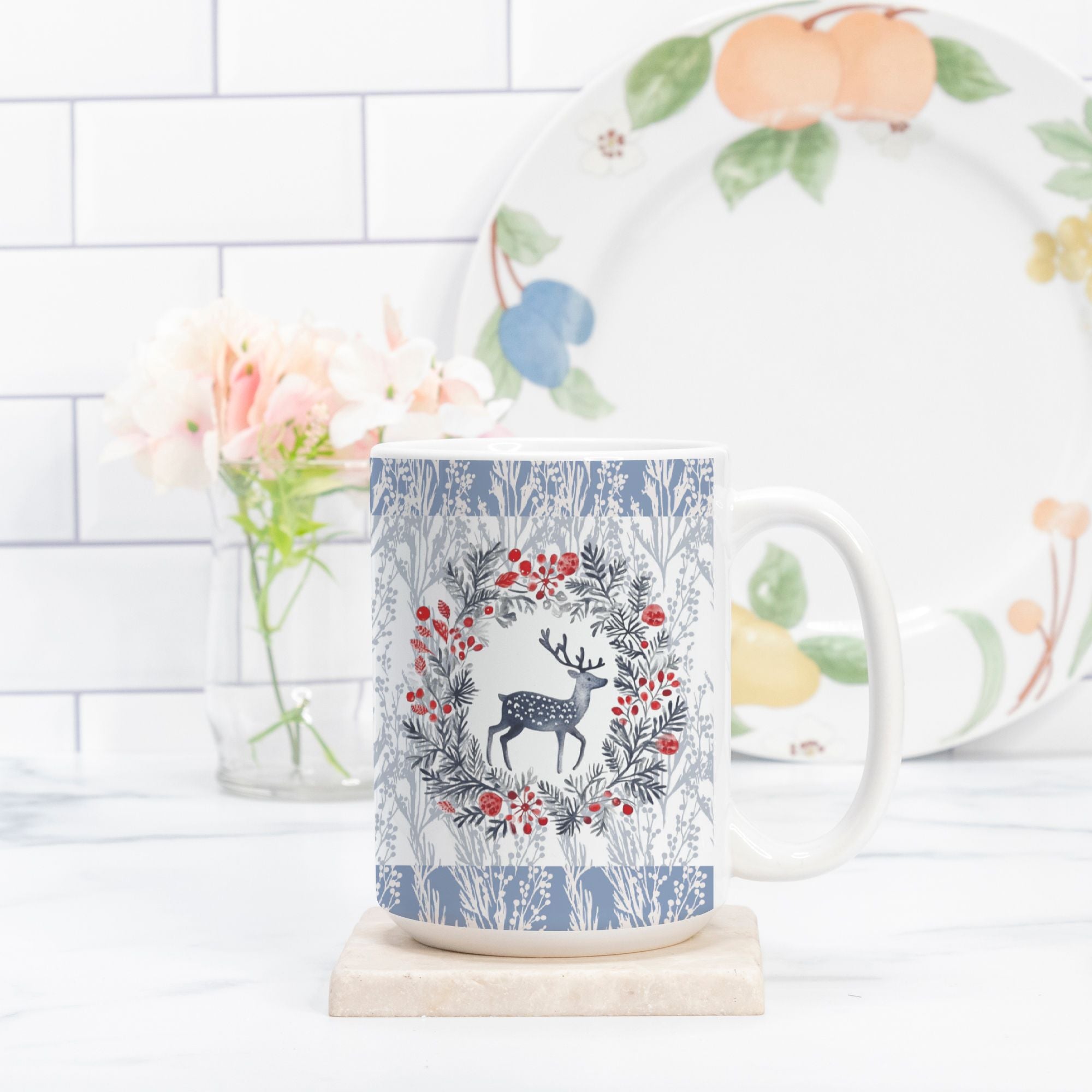 Mug with deer and floral design on a white surface with a blurred background
