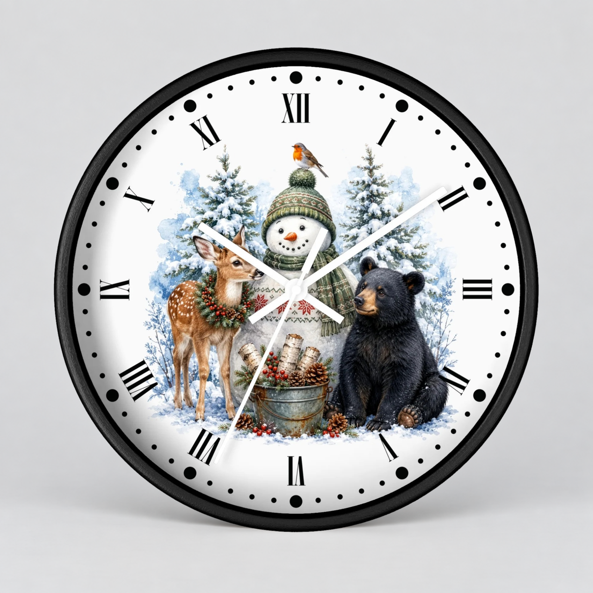 A round wall clock with a black frame and a white face featuring a winter holiday illustration. The design shows a snowman in a green hat and scarf, a brown deer, a black bear, snowy trees, pinecones, and a small bird.