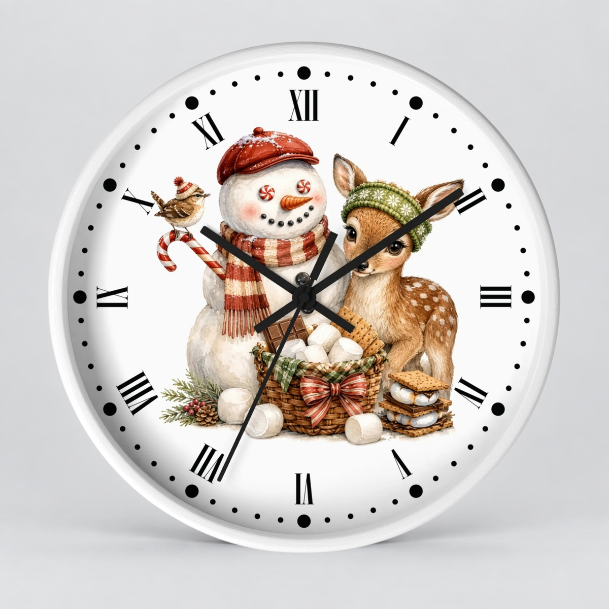 A round white wall clock with black Roman numerals and hands, featuring a festive illustration of a snowman in a red hat and scarf next to a brown deer with a green hat, on a light gray background.