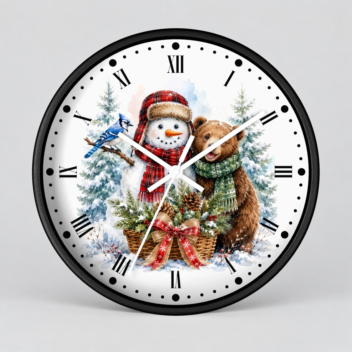 A round wall clock with a black frame and a festive winter illustration on the dial. The design shows a snowman in a red plaid hat and scarf, a brown bear wearing a green scarf, a blue jay, evergreen trees, and a basket of pinecones and gifts.