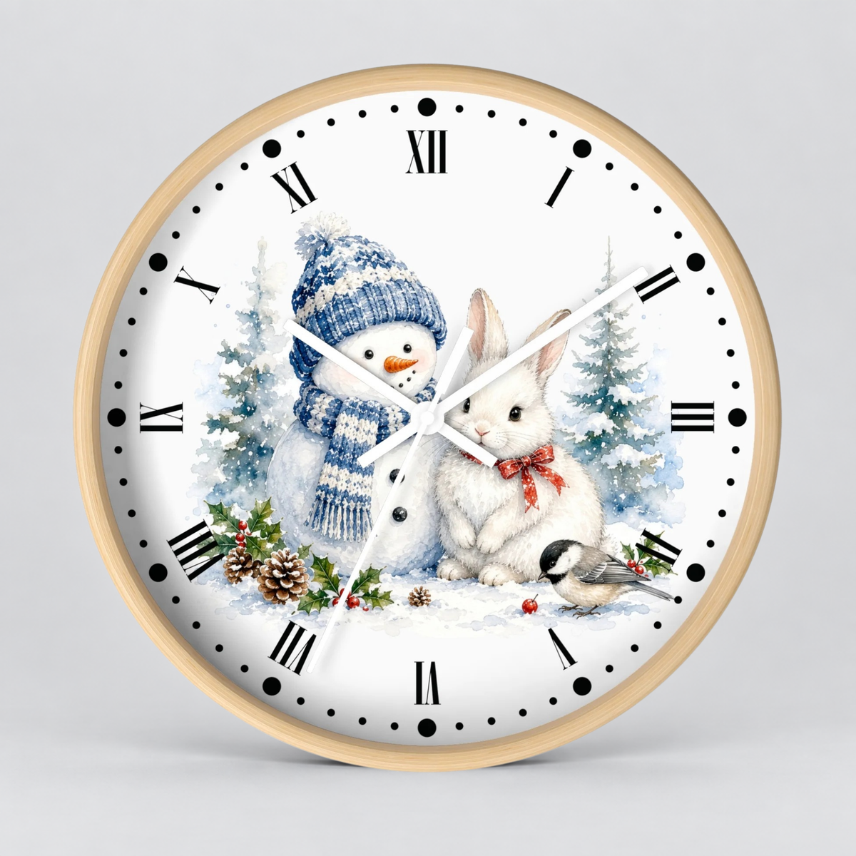 A round wall clock with a light wood frame and a white face featuring a winter holiday illustration of a snowman, a white rabbit, evergreen trees, pinecones, and a small bird. The clock has black Roman numerals and black hour markers with matching black dot indices, and the hands are white with black detailing.