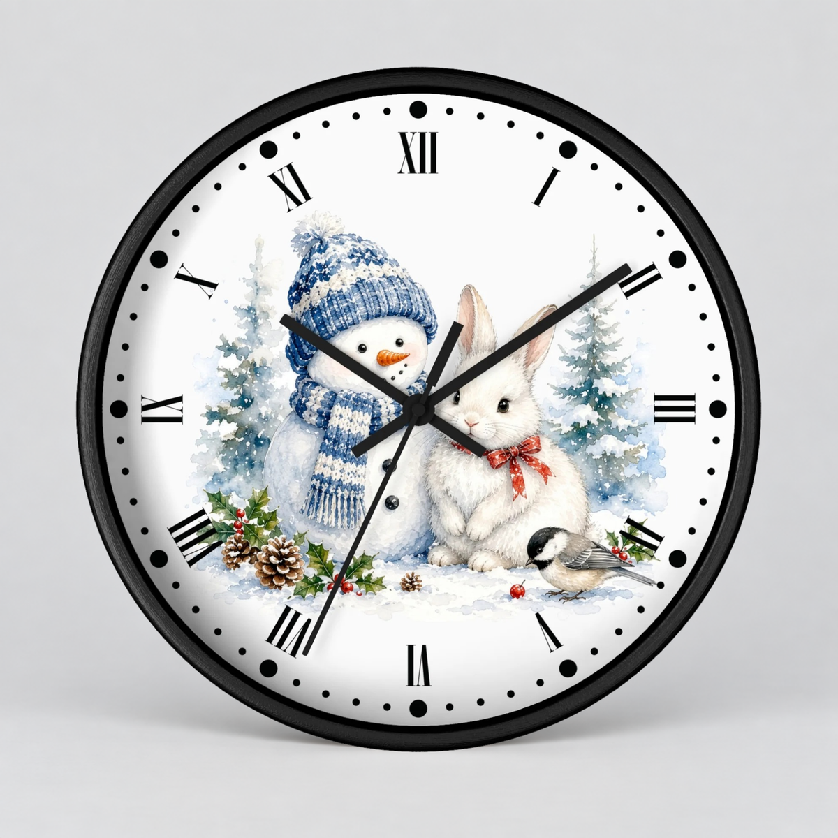 A round wall clock with a black frame and a white face featuring a winter holiday illustration of a snowman in a blue knit hat and scarf next to a white rabbit with a red bow, with a small bird and pine trees. The clock has black Roman numerals and black hands.