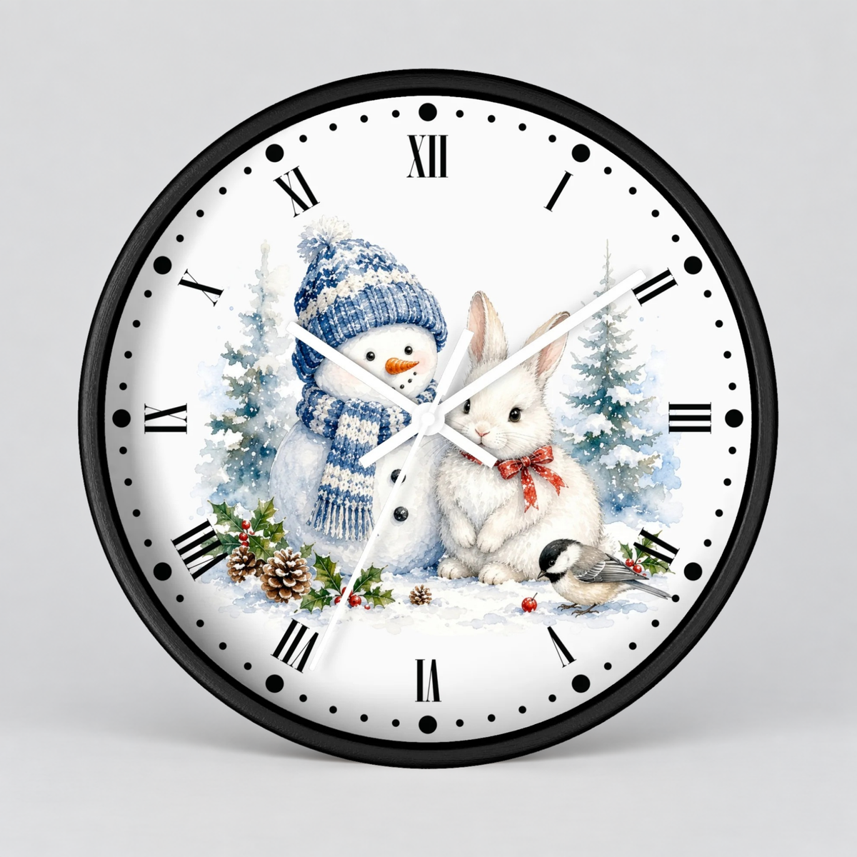 A round wall clock with a black frame and a white face featuring a winter holiday illustration of a snowman in a blue hat, a white rabbit with a red bow, evergreen trees, pinecones, and a small bird. The clock has black Roman numerals and white hands on a light gray background.