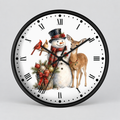 A round wall clock with a black frame and white face, featuring a winter holiday illustration of a snowman in a top hat and scarf, a deer, a cardinal, and evergreen branches. The clock is shown against a neutral light gray background.