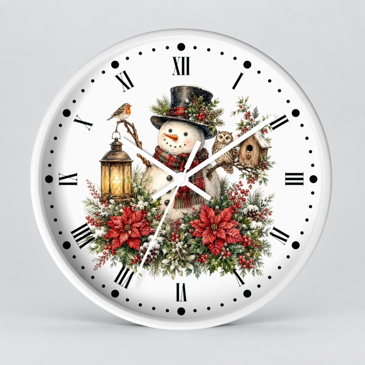 A round white wall clock with a festive Christmas design on the face, featuring a snowman in a black hat surrounded by red poinsettias, green foliage, a lantern, and a bird, with black Roman numerals and white hands against a light gray background.