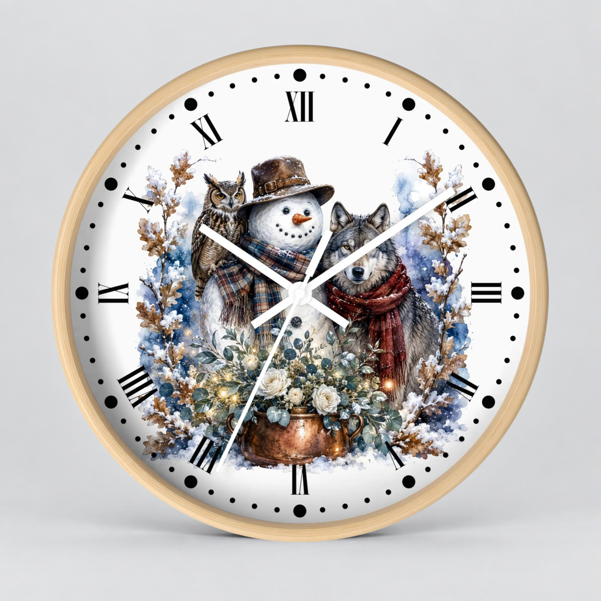 A round wall clock with a light wood frame and a white face, featuring a winter illustration of a snowman, a wolf, an owl, and a copper pot of flowers. The clock is shown against a neutral light gray background.